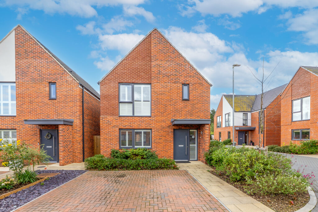 front property exterior. edited with blue skies on a grey day. 